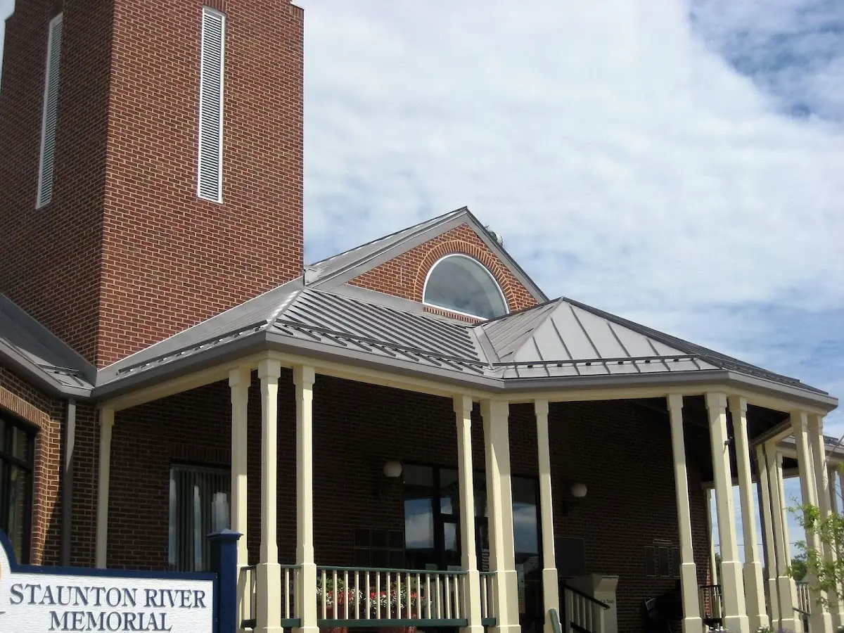 Skilled roofing craftsmen working on a residential roof in Crestview Meadows